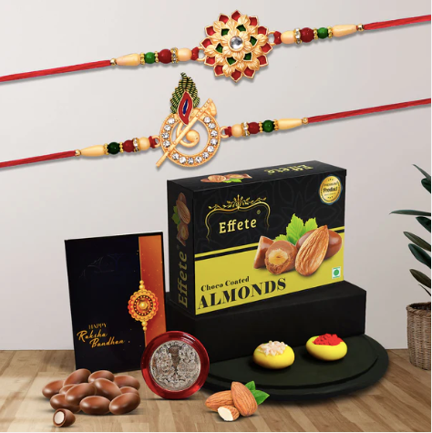 Rakhi Combo Gift Set – 2 Designer Rakhis with Silver Coin, Roli Chawal & Chocolate