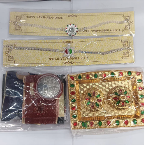 Silver Rakhi Gift Set – 2 Designer Rakhis with Pooja Thali, Silver Coin & Chocolate