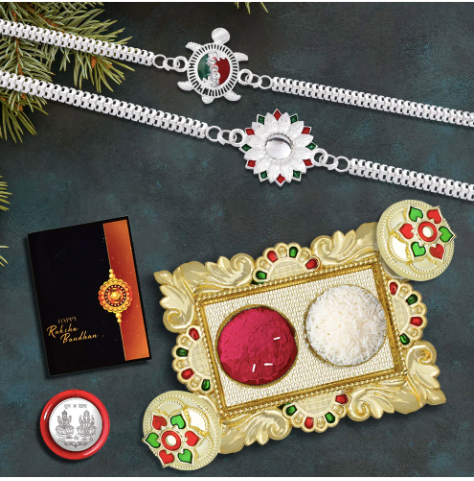 Silver Rakhi Gift Set – 2 Designer Rakhis with Pooja Thali, Silver Coin & Chocolate